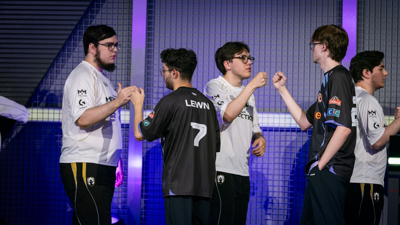 Karmine Corp and Team Heretics players exchange fist bumps after the match