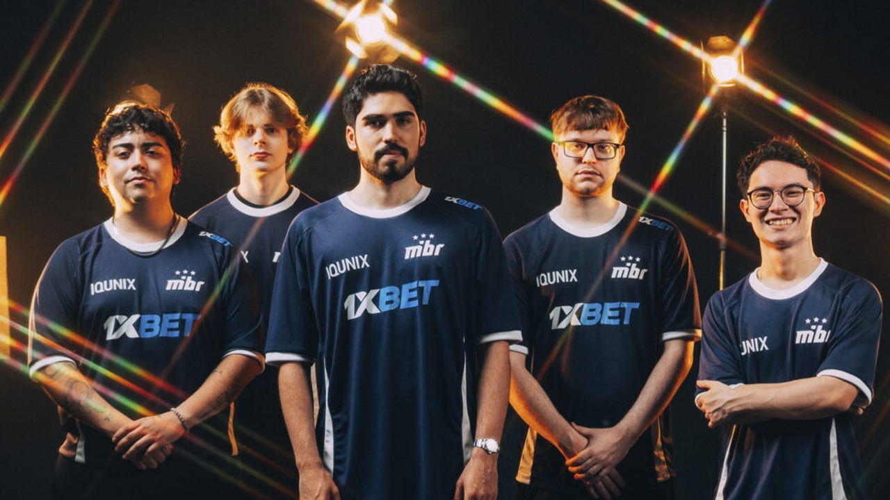 Five MIBR Valorant players stand together in dark team jerseys