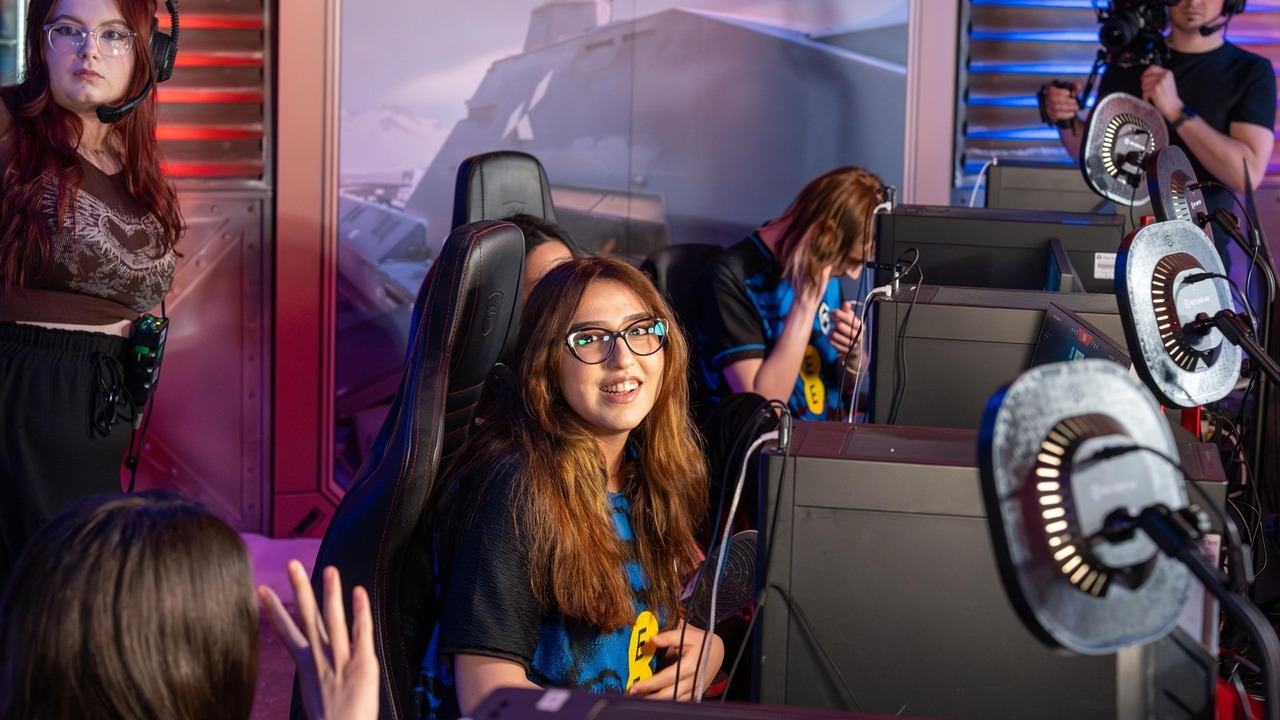 GIANTX GC players sit at computers during a Valorant event